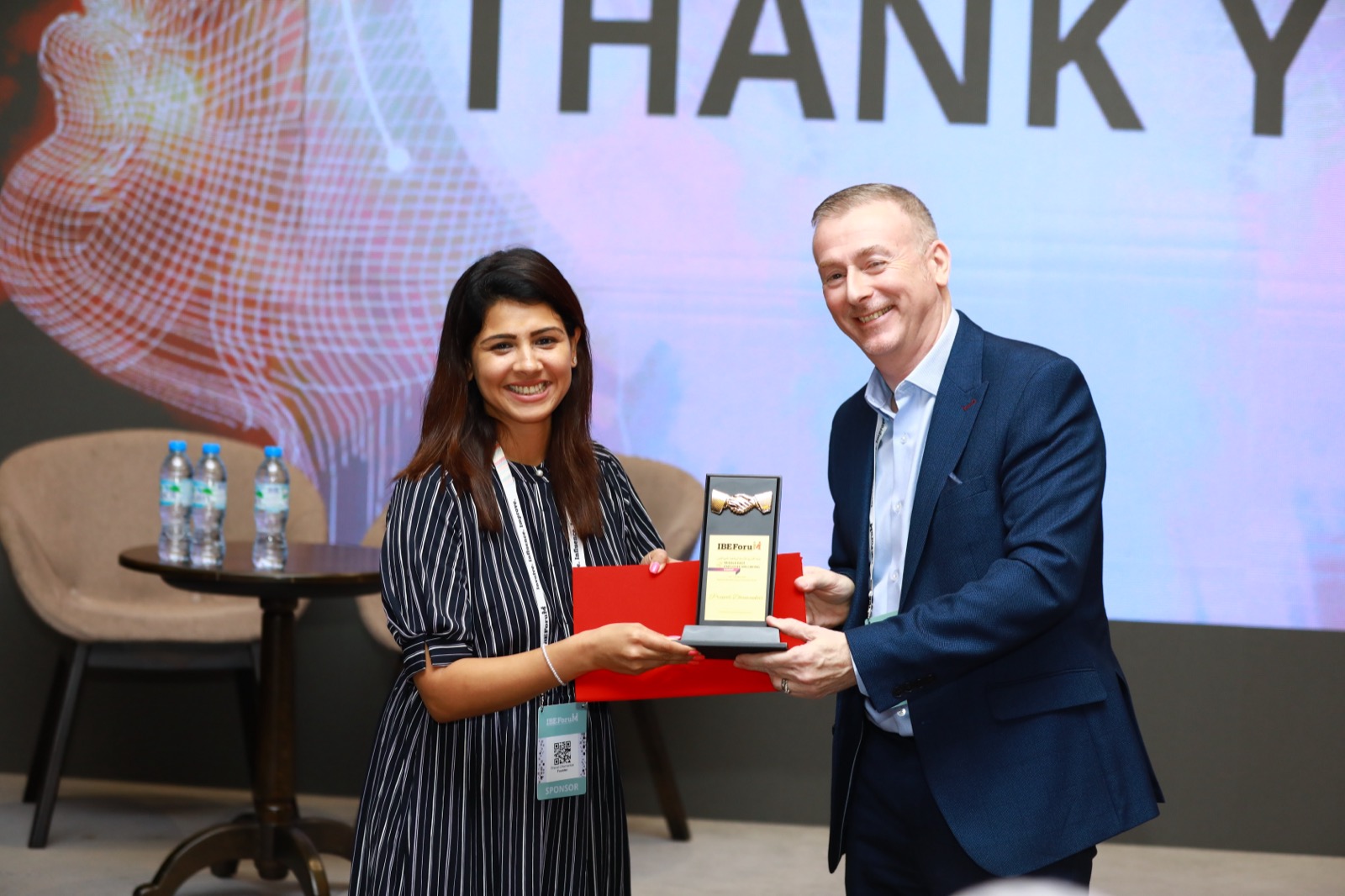 Pranalli Dhamankar receiving award at IBEForum